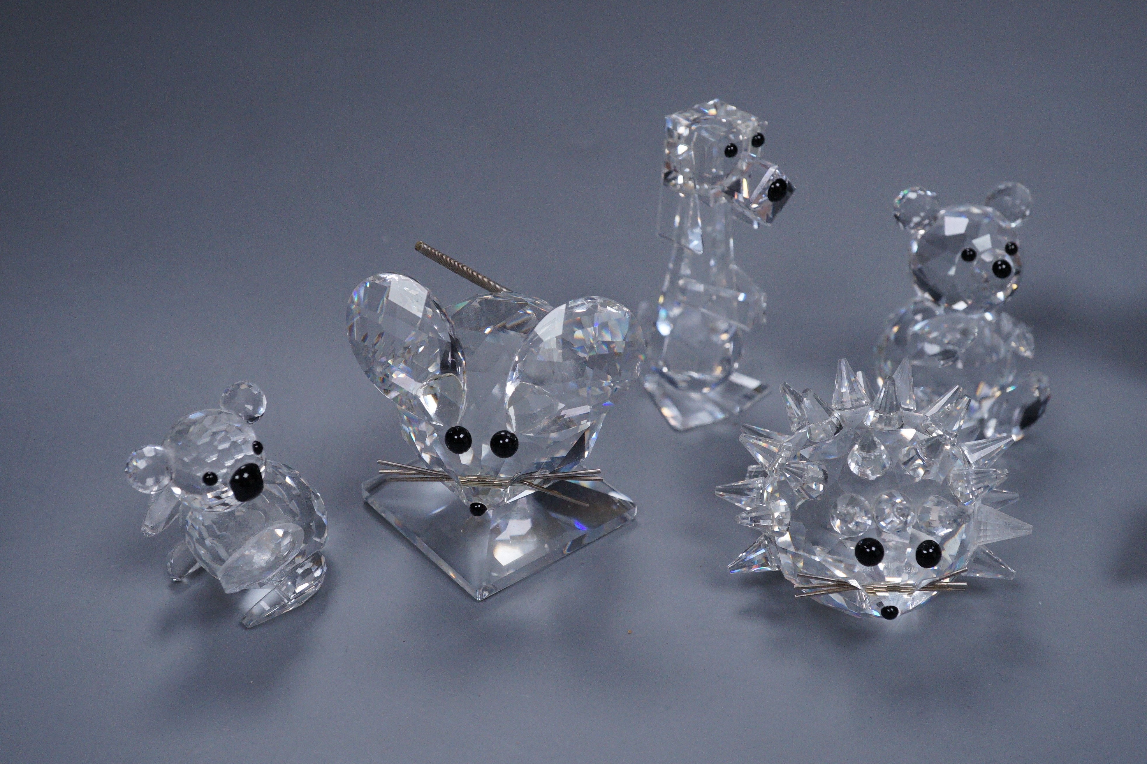 A group of Swarovski crystal (5) and four porcelain animal models, three Doulton and one Rosenthal